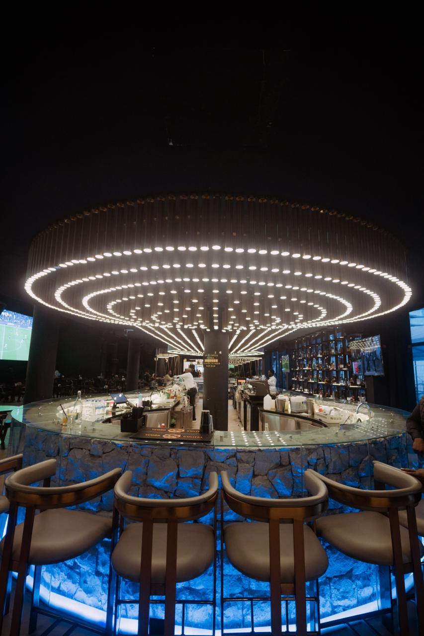 Circular bar with dramatic lighting fixture